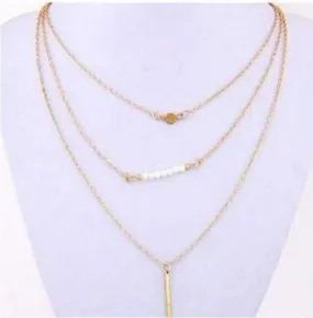 Delicately Layered Pearl and Gold Triple Chain Necklace