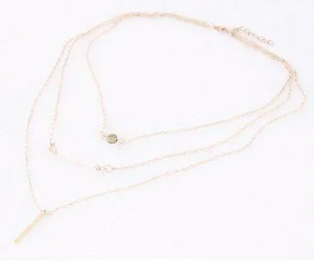 Delicately Layered Pearl and Gold Triple Chain Necklace