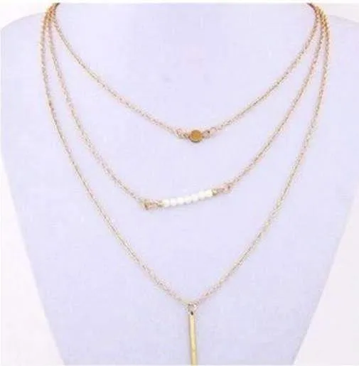 Delicately Layered Pearl and Gold Triple Chain Necklace