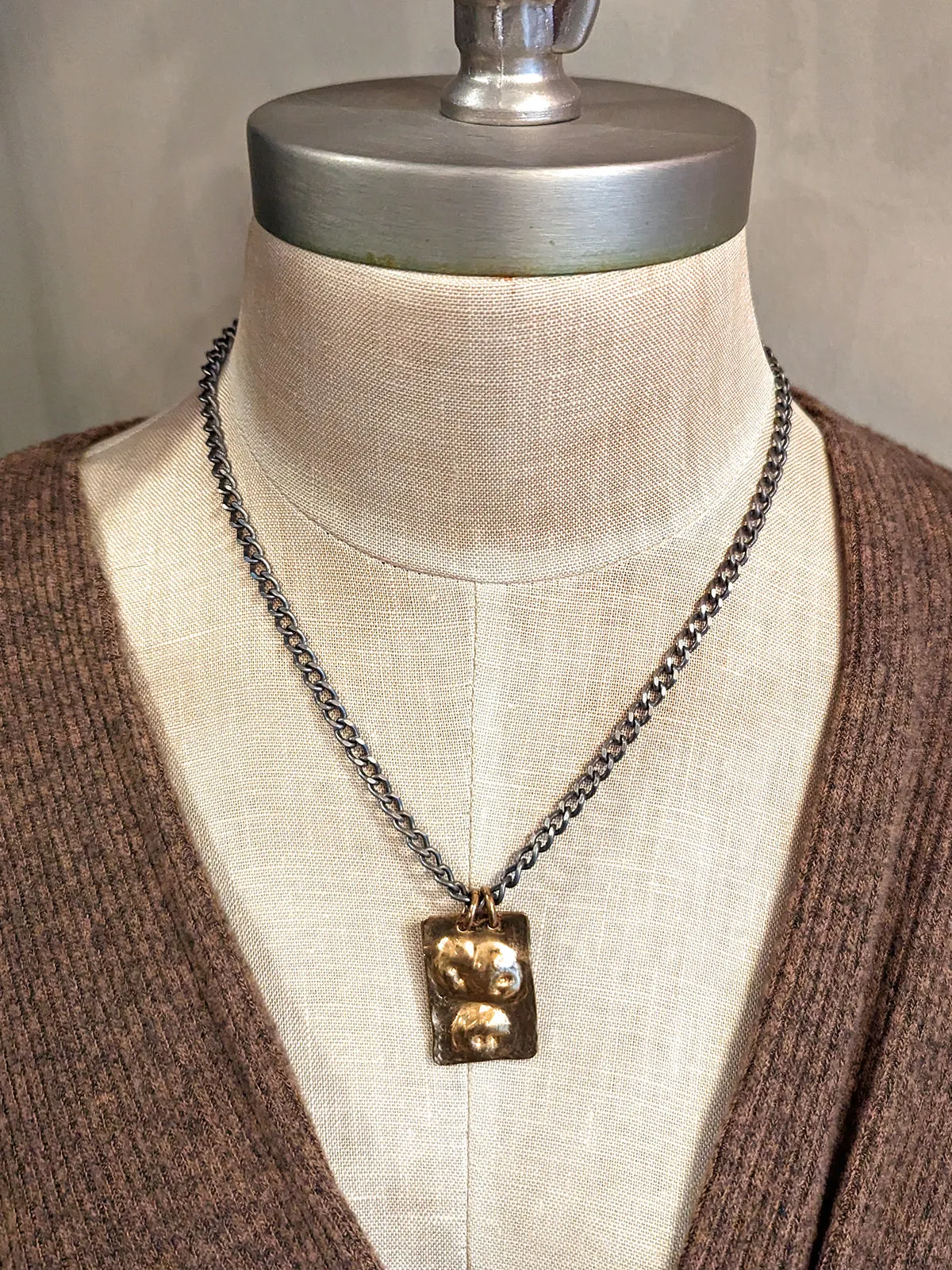 Dennis Higgins Emerging Skulls Pendant Necklace